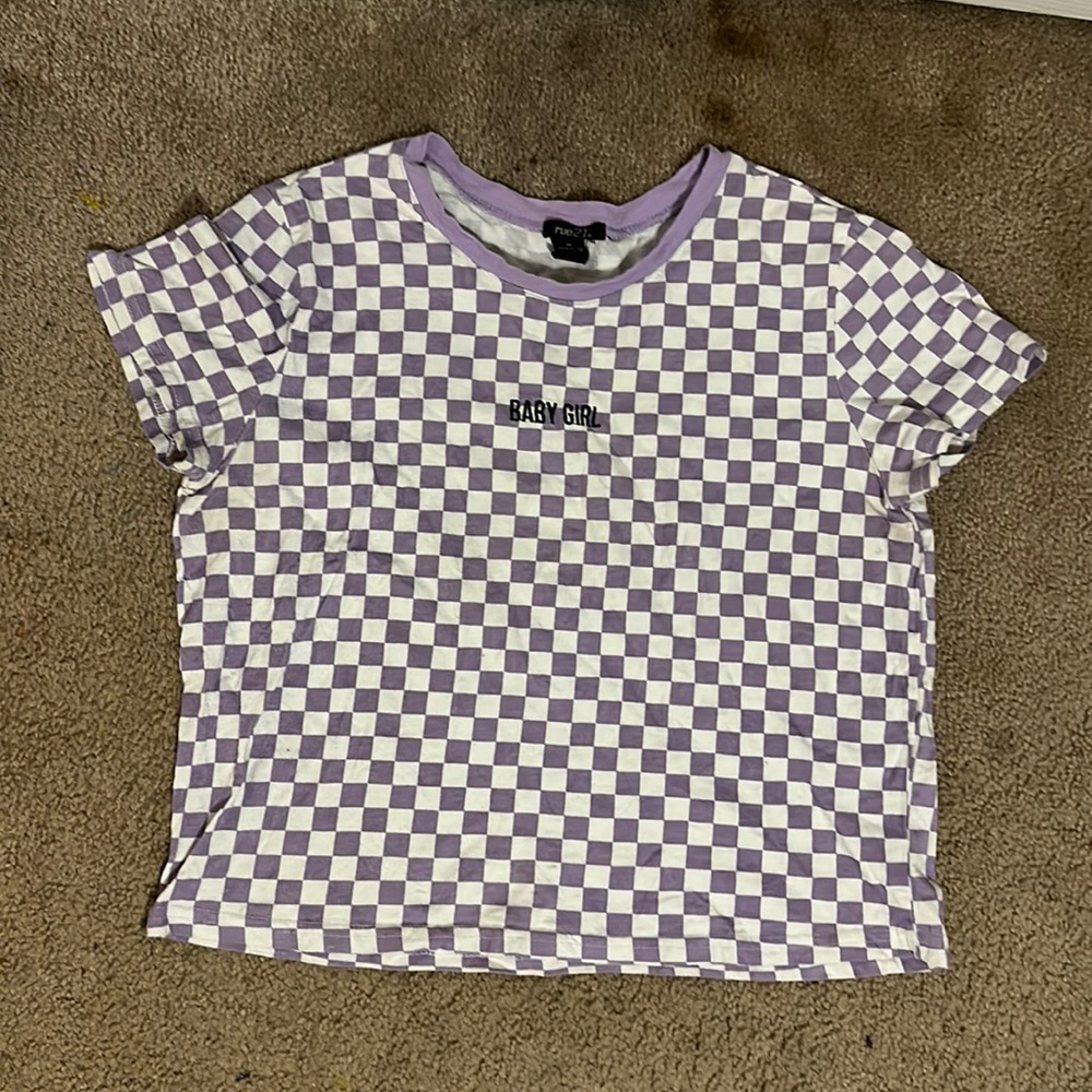 Short sleeved, cropped purple and white top. It’s by rule 21 and is a medium